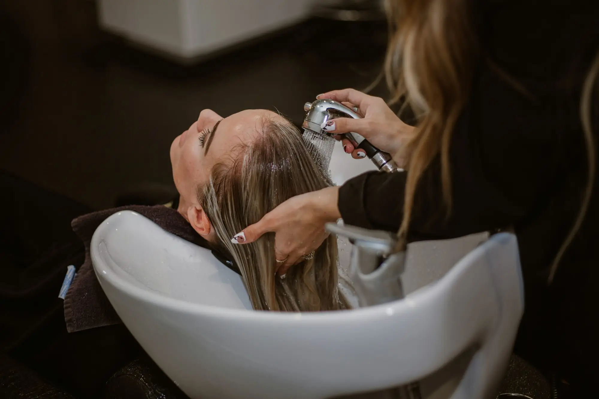Hair rinsed at the basin at the close of a scalp health head spa at Fiona's Day Spa in Coon Rapids, MN