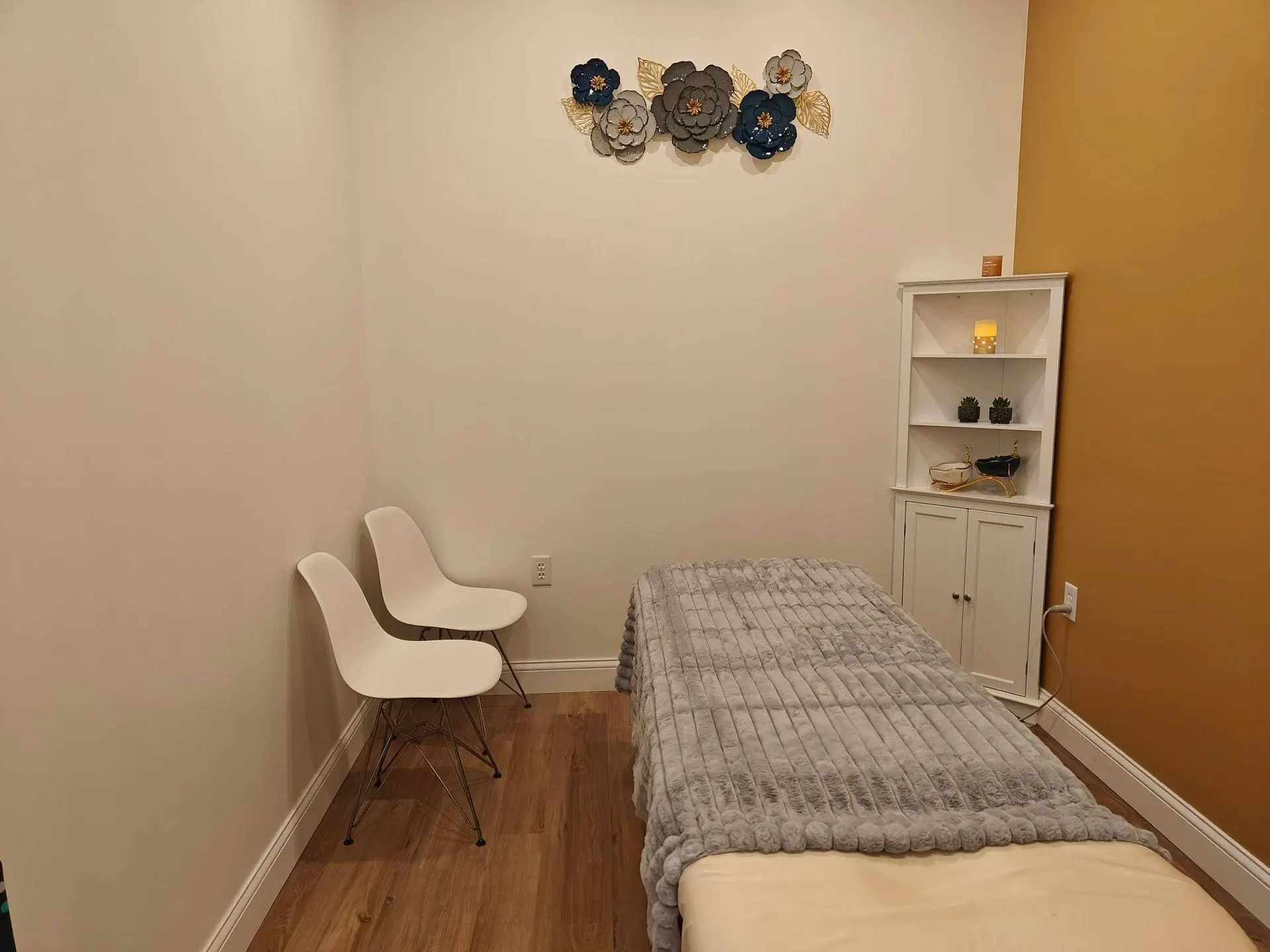 Treatment room at Fiona's Day Spa with ochre walls, set for a facial and massage
